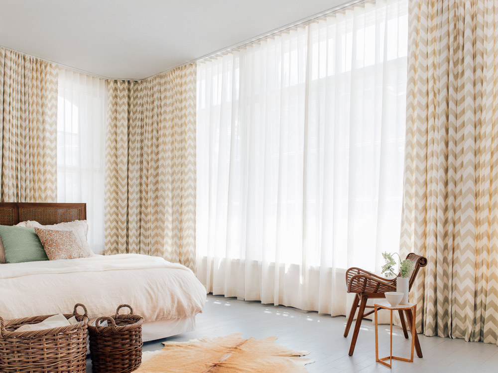 Layered bedroom drapery.
