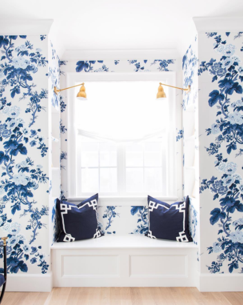 white roman shade blue wallpaper