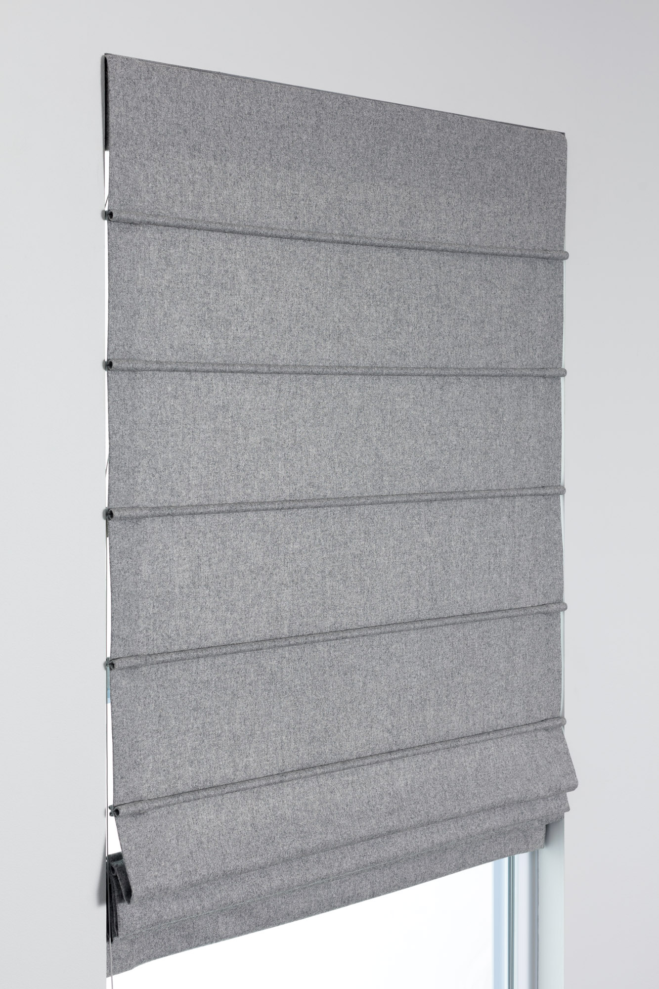 Aventura Roman Shade style in gray fabric with front dowels, showing a structured grid-inspired Roman Shade style.