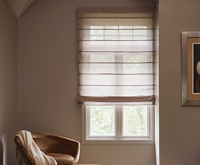 Aventura linen Roman Shades made of Luxe Sheer Linen in Natural lend a zen-like aesthetic to a quiet sitting room