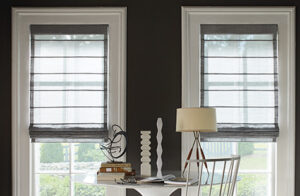 Roman shades for windows include Aventura Roman Shades made of Wool Blend in Urban Grey in a darkly painted room