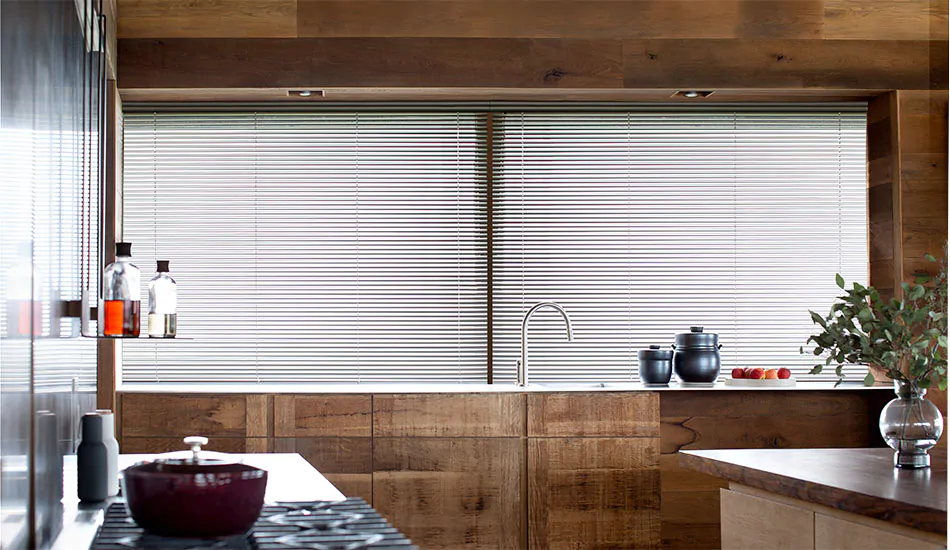 Inside mount blinds made of Econo Blinds in Silver deliver a linear look to a mid century modern kitchen