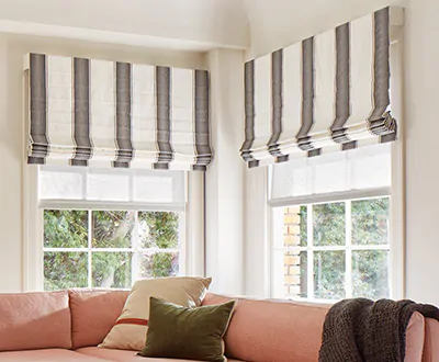 An example of white and black Roman Shades in the Cascade Style has Martyn Lawrence Bullard's Nomad Stripe in Graphite