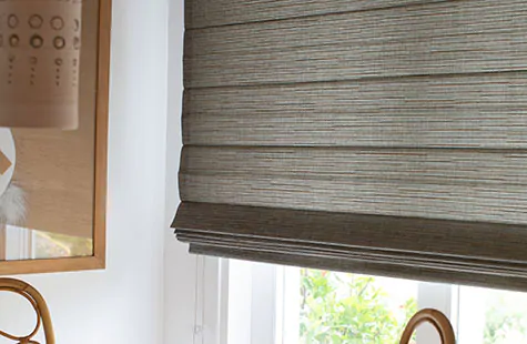 Bamboo blinds made of Jackson in Sun offer a warm gray tone and lots of texture to a mid century modern dining room