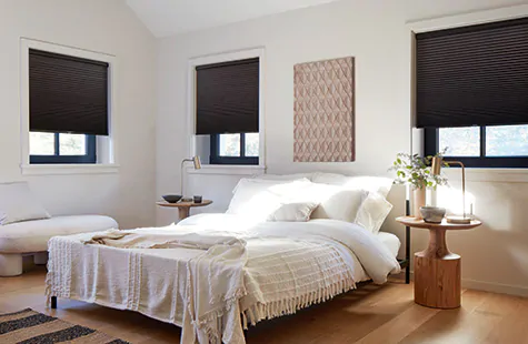 To answer what are cellular shades, a Cellular Shade in a modern bedroom shows the blackout material option in midnight