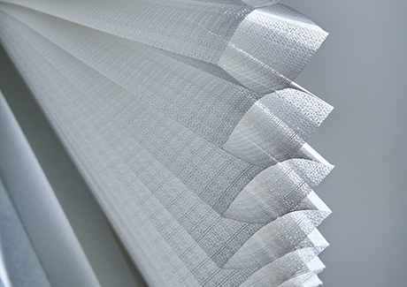 To answer what are cellular shades, an image of a single cell cellular shade made of Lace material shows the honeycomb design