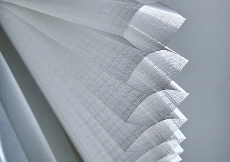 To answer what are cellular shades, an image of a single cell cellular shade made of Lace material shows the honeycomb design