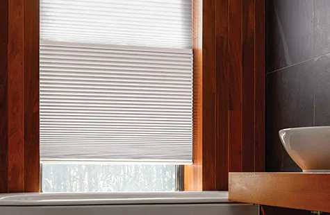 To answer what are cellular shades, a Cellular Shade in a modern bathroom shows the Day Night version of Cellular Shades