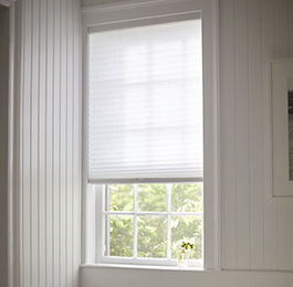A back room has privacy shades in the Cellular Shade style made of Single Cell light filtering material in Lace as decorative window coverings for privacy