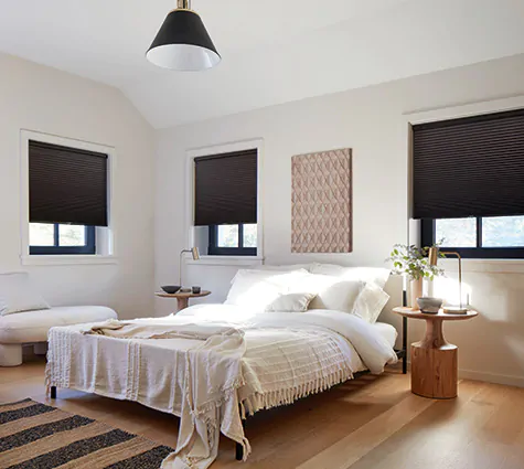Cellular Shades made of 3-4-inch Single Cell Blackout material in Midnight cover windows in a contemporary bedroom