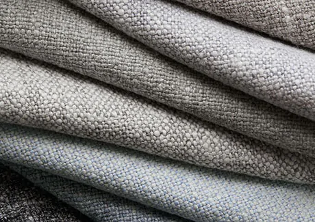 Product shot of fabric for thermal curtains focusing on the thick, absorptive fabrics like wool with natural fibers