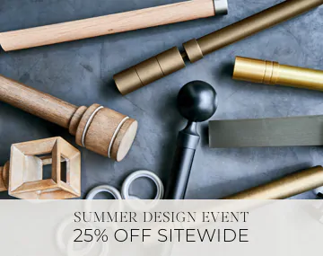 Pieces of drapery hardware in metal & wood finishes lay on a stone table with sales messaging for Summer Design Event 25% Off