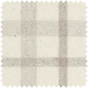 A close-up shot of a material swatch for plaid curtains in Aberdeen Bisque that has a inviting, warm look and feel