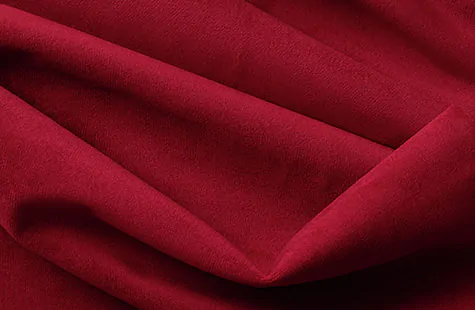 A close up of Posh Velvet in Crimson shows the luxurious soft texture, subtle sheen and rich color of the fabric