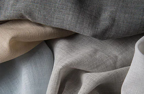 A close up of Holland and Sherry's Wool Challis swatches shows the soft, textured look of this material for curtain sheers