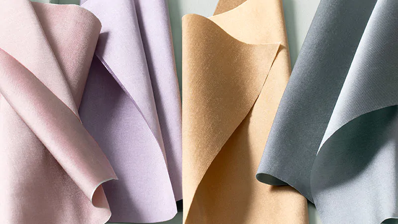 A close-up of Silk Dupioni swatches in lovely pastel colors deliver a subtle sheen and softness characteristic of silk