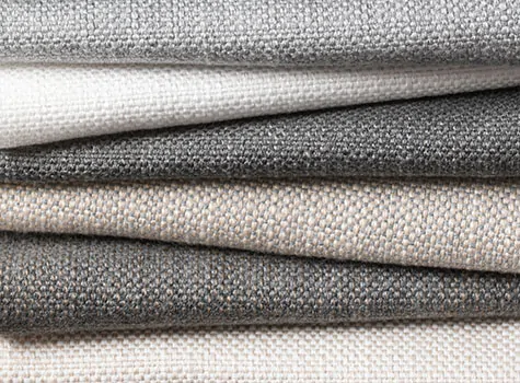 Swatches of Sunbrella Alma fabric in neutral colors are stacked and make a great choice for curtains to keep heat out