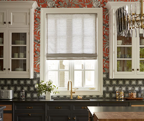 Roman Shades for kitchen windows include Flat Roman Shades in Tangier Weave, Desert, in a kitchen with red floral wallpaper