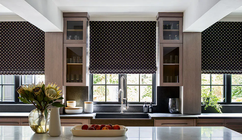 Black Roman Shades made in the Flat Roman Shade style of Nate Berkus' Gemma in Noir add a bold look to a modern kitchen