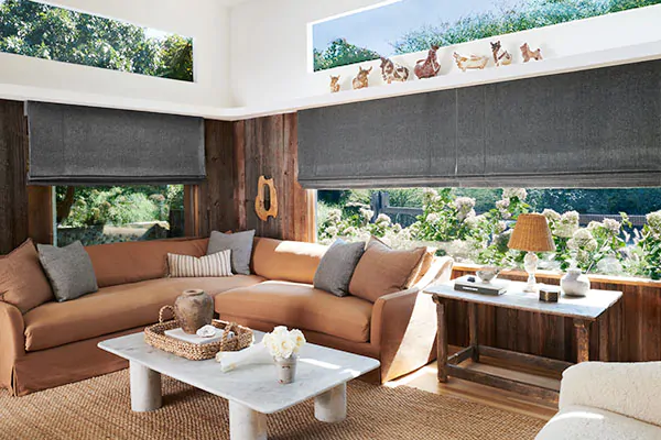 Flat Roman Shades made of Nate Berkus' Lowell Tweed in Flint offer a stony grey color to contrast the warm earthy tones