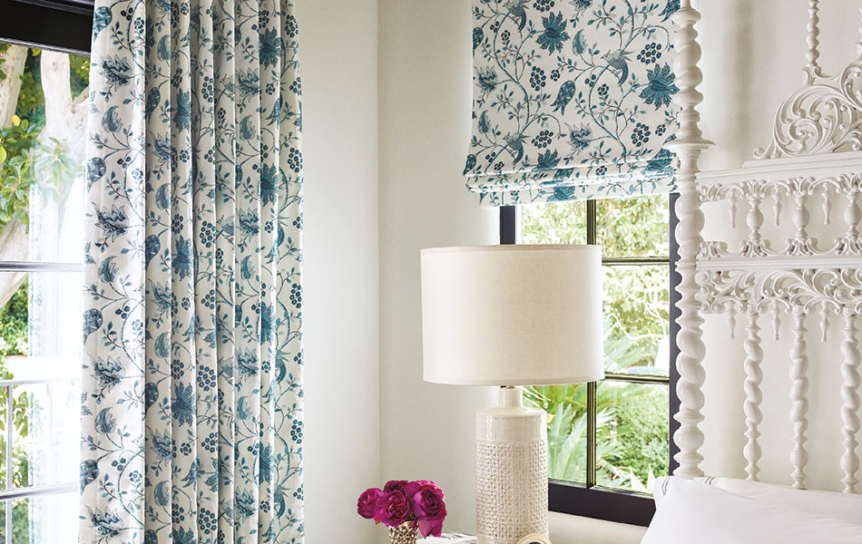 Flat linen Roman Shades made of Martyn Lawrence Bullard's Boho Vine in Ocean add color and movement to a boho bedroom