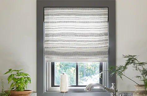 Sunroom window treatments benefit from lining such as a Flat Roman Shade made of Tidal Line in Slate with privacy lining