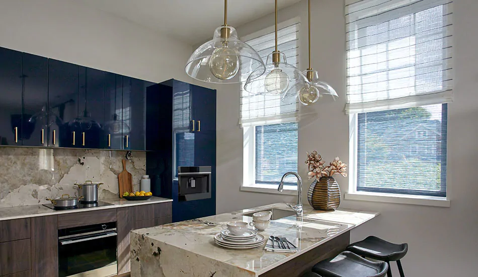 Contemporary window treatments in a urban kitchen include flat roman shades with a neutral color and subtle stripe pattern