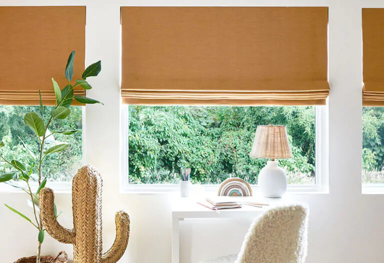 A child's room has flat linen Roman Shades made of Nate Berkus Lisbon Woven in Bronze for an inviting warm color