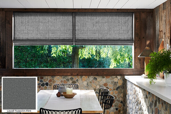 A warm, stone-inspired grey like Lowell Tweed in Flint on these Flat Roman Shades is one of the window treatment trends 2024