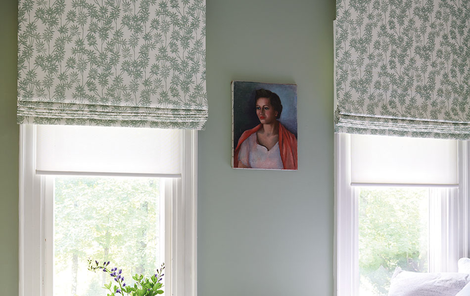 Flat linen Roman Shades made of The Novogratz Daisy Bloom in Sage adds a vintage look to a bedroom with mint green walls