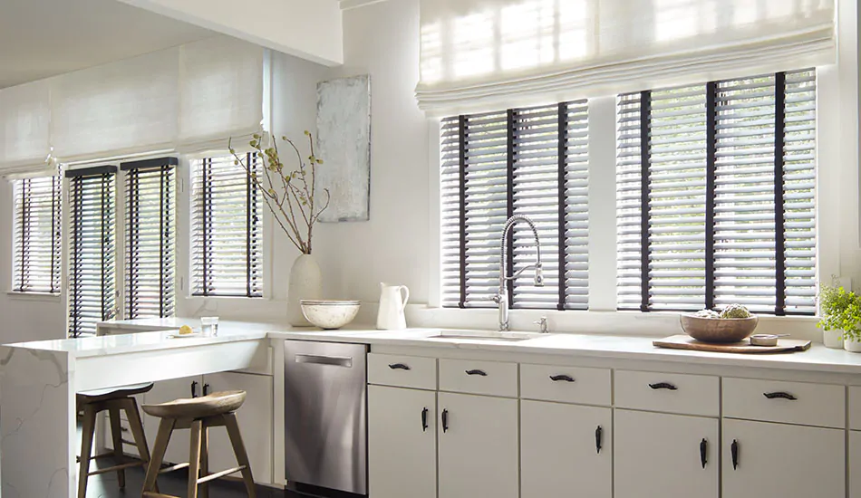 Inside mount blinds made of Painted Bamboo in Coal offer a stark contrast to the white, bright kitchen