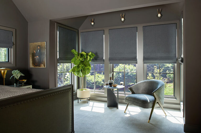 A cozy bedroom with Flat Roman Shades made of Wool Blend, Charcoal shows the results of leaning how to install Roman Shades