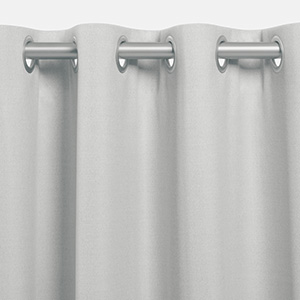 One of the types of drapes is Grommet Drapery which features metal rings pressed into the drape panels an inch from the top