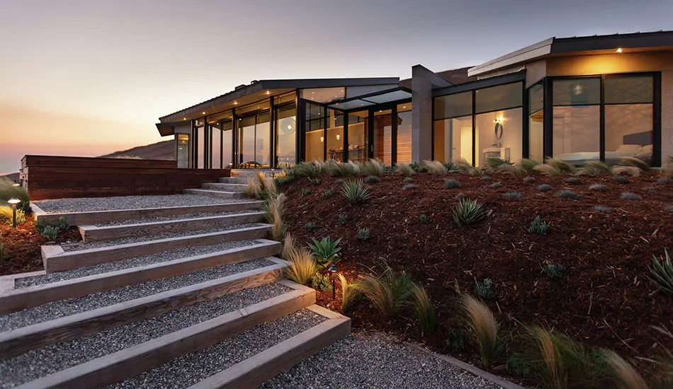 A modern ranch home in the middle of the desert decided between curtains or no curtains, bare windows was the way to go