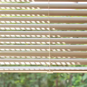 A close up of Metal Blinds made of 2-inch Champagne feature a subtle gleam and offer great bathroom window privacy