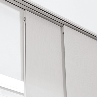 A close-up of a baton hanging from the top of vertical blinds in a panel track system showing how to pull window blinds down