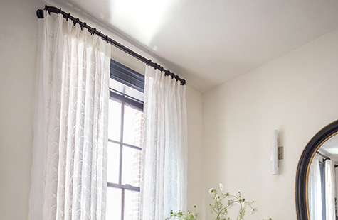 French return curtain rods like Lafayette in Matte Black offer easy use for Pinch Pleat Drapery in Feather Palm Embroidery