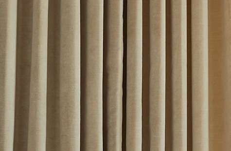 A close up of Velvet in Cream shows the plush weight and unique, subtle horizontal texture that gives it its luxe appeal