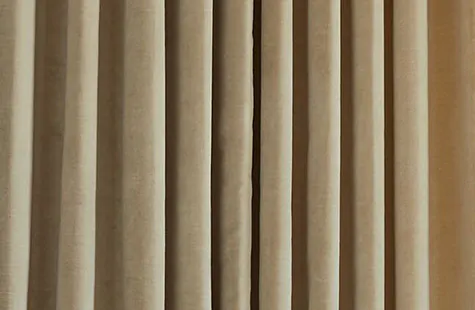A close up of Velvet in Cream shows the plush weight and unique, subtle horizontal texture that gives it its luxe appeal