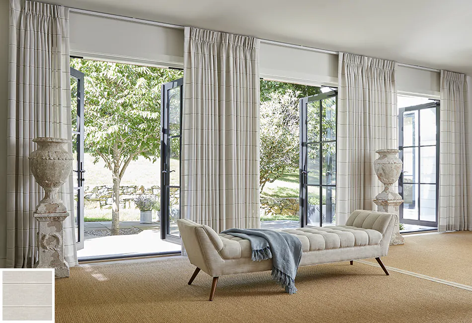 Curtain ideas for living rooms don't get much more classic than this space with three French doors and pinch pleat drapes