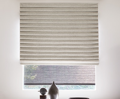 A Pleated Roman Shade made of Wool Blend in Fleece offers a lush, elegant look to an otherwise minimalist space