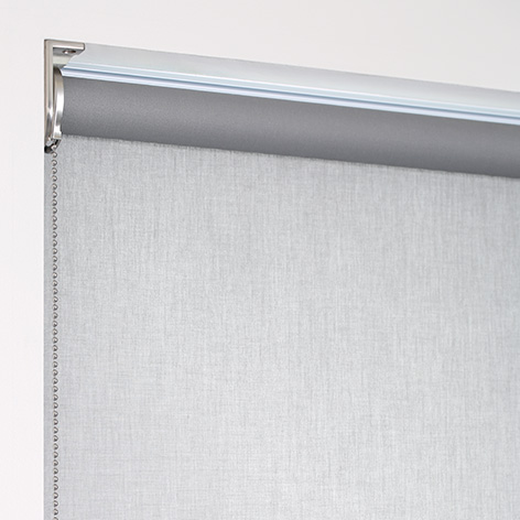 A product image of a regular roll shade with material falling off the back of the tube