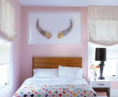 Relaxed Roman Shades made of The Novogratz Zebra Marble in Waverly Pink add visual interest to a girl's pink bedroom