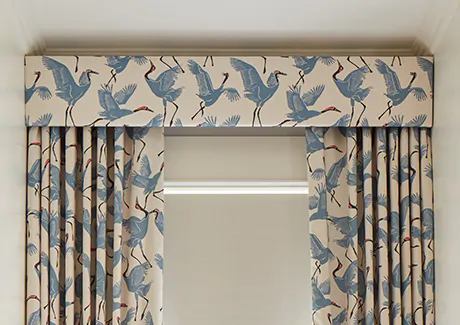 Ripple Fold Drapery in Family of Cranes, Wavery Blue with a matching cornice helps block light while offering a bold pattern
