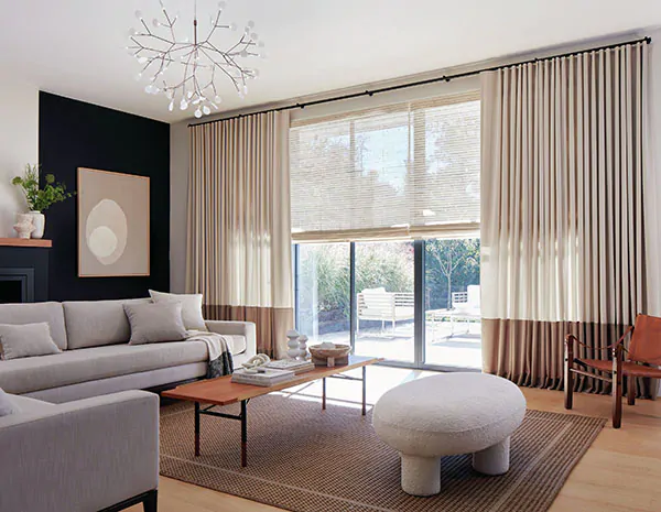 Neutral MCM curtains made of Andes in Castle Wall with a bottom border of Andes in Rye add dimension to a mid century modern living room