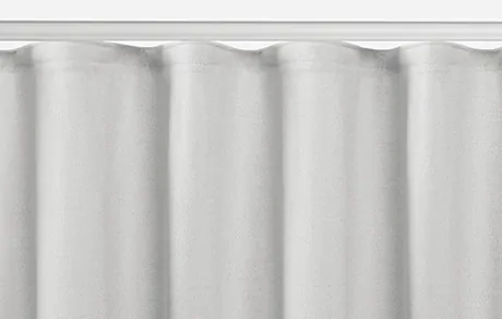A product image of Ripple Fold Drapery shows the soft S-curves of this modern pleat style that give it a soft linear look