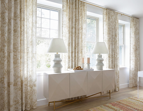 Ripple Fold Drapery made of Wildvine in Flax adds a charming botanical element to a boho home office with light wood tones
