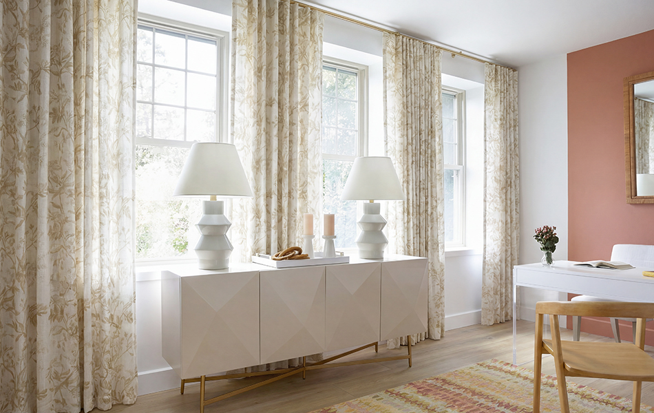 Ripple Fold Drapery made of Wildvine in Flax adds a charming botanical element to a boho home office with light wood tones