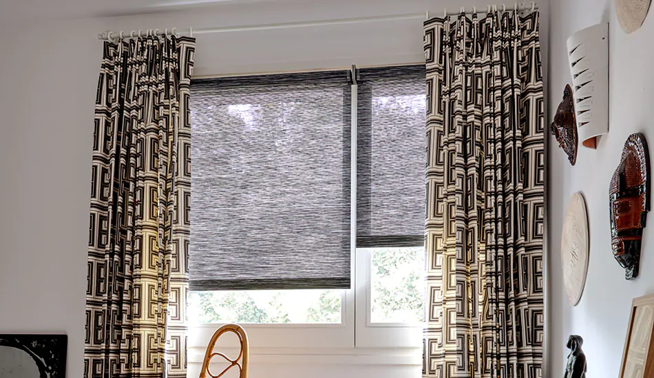 Basement window curtains made of Tailored Pleat Drapery of Peking Greek Key in Raven add a bold pattern to an office