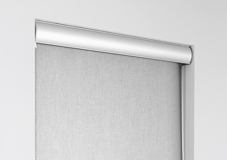 A product image of a metal valance for roller shades shows how similar a cornice vs valance can be